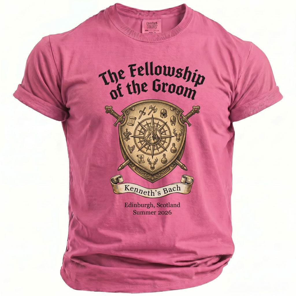 Pink t-shirt with shield, swords, and text "The Fellowship of the Groom", "Kenneth's Bach", and location/date.