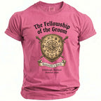 Pink t-shirt with shield, swords, and text "The Fellowship of the Groom", "Kenneth's Bach", and location/date.