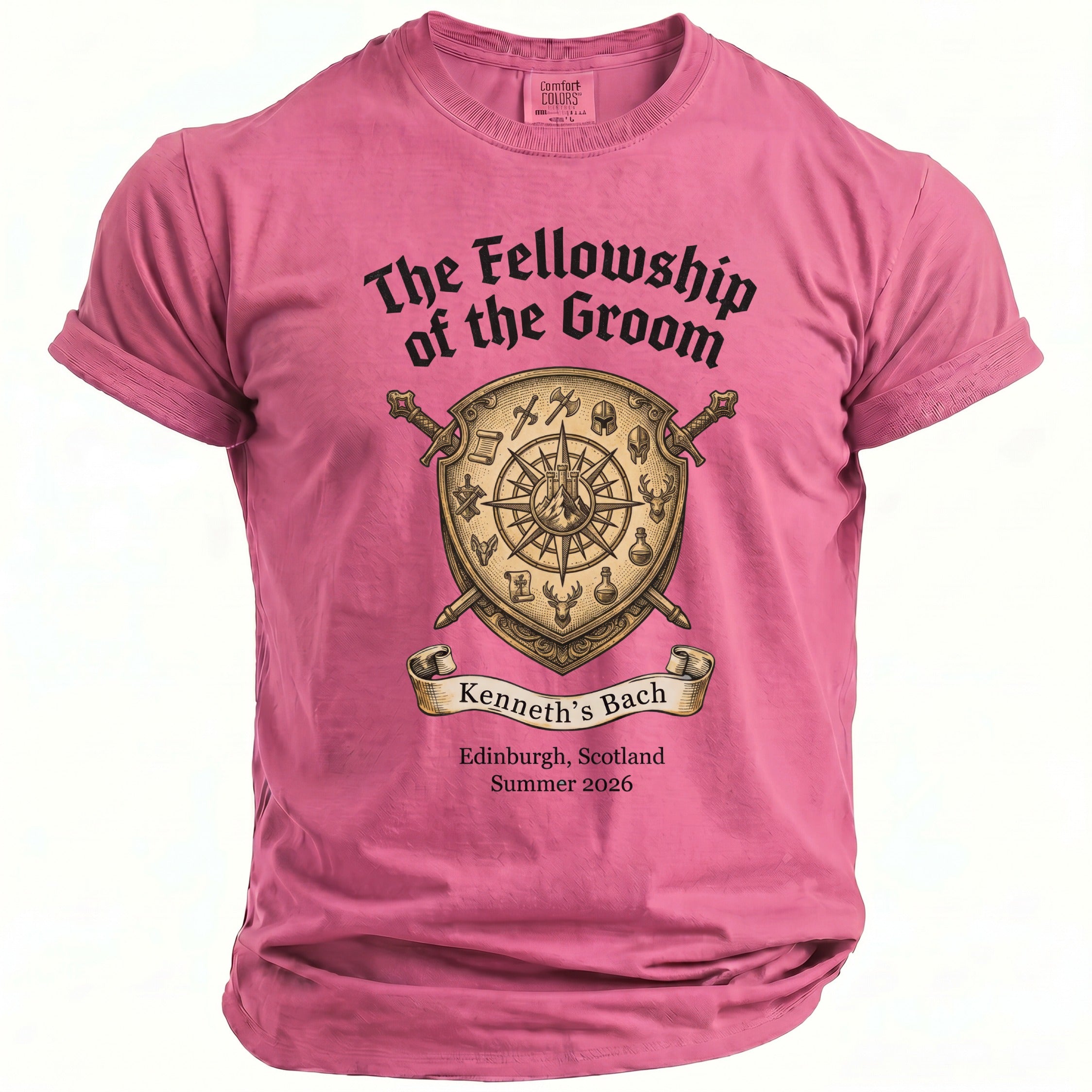 Pink t-shirt with shield, swords, and text "The Fellowship of the Groom", "Kenneth's Bach", and location/date.