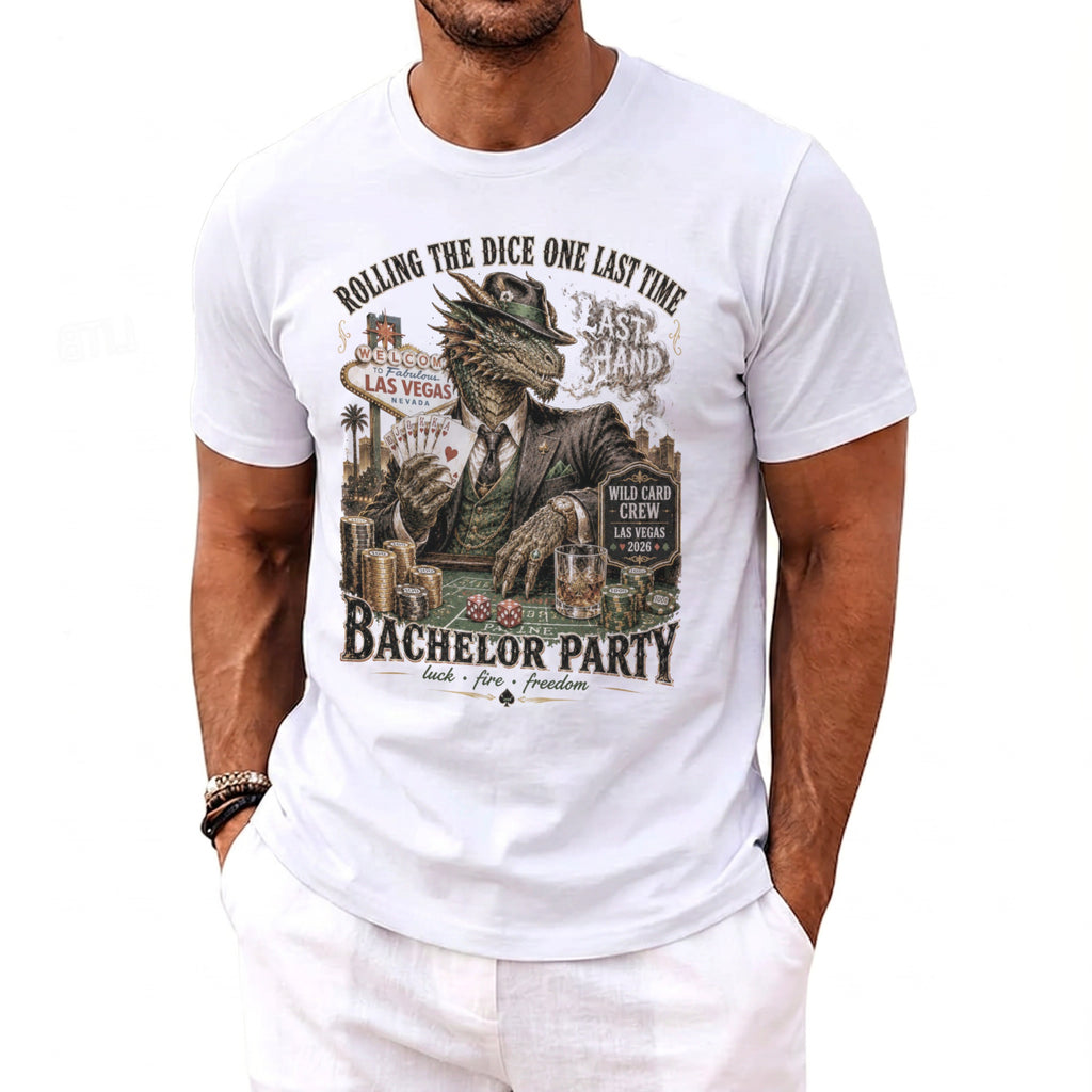White t-shirt graphic of a dragon in a suit holding cards and dice in Las Vegas.