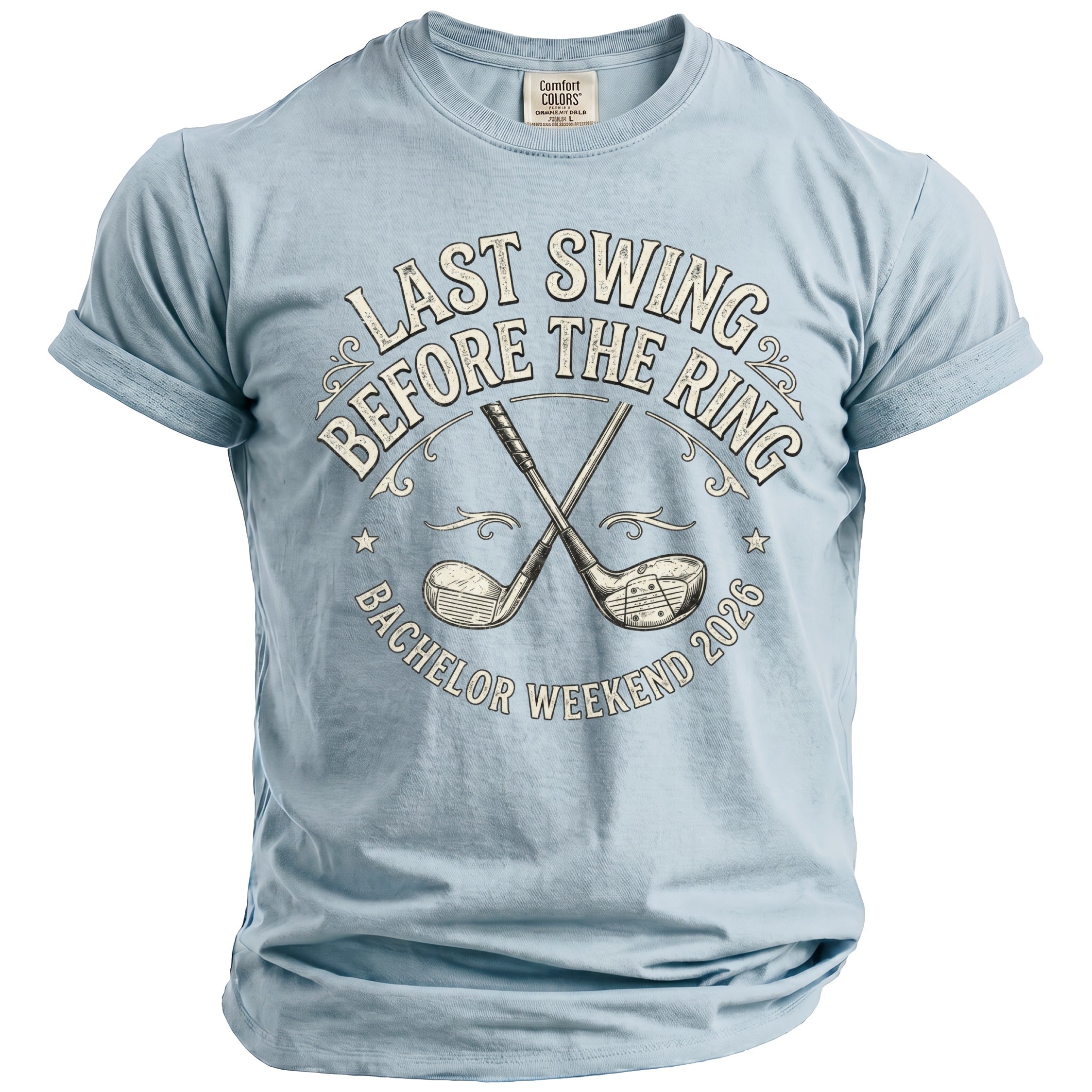 Light blue t-shirt with "Last Swing Before The Ring Bachelor Weekend 2026" and golf clubs.