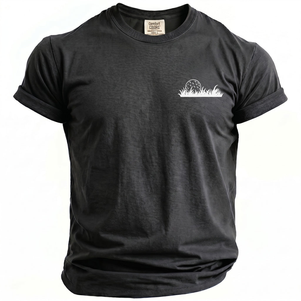 Black Comfort Colors t-shirt with a white golf ball and grass graphic.