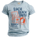 Light blue t-shirt with "Bach Beach Party" text, cooler, beach ball, and sunglasses graphic.