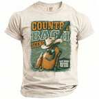 Country Bach Scene t-shirt graphic with guitar, hat, and Nashville 2026 text.
